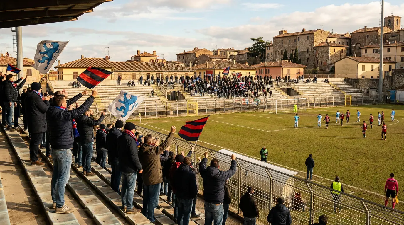 Stadio di provincia italiano durante una partita di Serie B con tifosi sugli spalti
